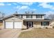 Charming two-story home with brick accents, a two-car garage, and a well-maintained front yard at 3257 S Geneva St, Denver, CO 80231