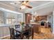 Bright eat-in kitchen with wood floors, granite countertops, and a sunny breakfast nook at 3257 S Geneva St, Denver, CO 80231