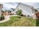 Spacious backyard with a well-maintained lawn, patio area, and attractive landscaping at 1721 S Jackson St, Denver, CO 80210
