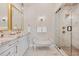 Elegant bathroom with a double vanity and a glass enclosed shower at 1721 S Jackson St, Denver, CO 80210