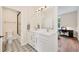 Well-lit bathroom with double vanity, granite countertop, and tiled floors and shower at 1721 S Jackson St, Denver, CO 80210