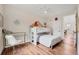 bedroom with a bunk bed, desk and wood floors at 1721 S Jackson St, Denver, CO 80210