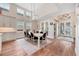 Elegant dining room with hardwood floors, vaulted ceilings, and stylish lighting fixtures at 1721 S Jackson St, Denver, CO 80210