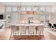 Gourmet kitchen with quartz countertops, center island, and stainless steel appliances at 1721 S Jackson St, Denver, CO 80210