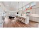 Open-concept kitchen features a large island, stainless steel appliances, and seamless flow to the living room at 1721 S Jackson St, Denver, CO 80210