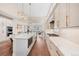 Spacious kitchen boasts marble countertops, stainless steel appliances and seamless flow to living spaces at 1721 S Jackson St, Denver, CO 80210