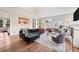 Spacious living room with hardwood floors, comfortable seating, and abundant natural light at 1721 S Jackson St, Denver, CO 80210