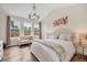 Serene bedroom with hardwood floors, accent lighting and a cozy seating area at 1721 S Jackson St, Denver, CO 80210