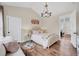 Bright and airy main bedroom with hardwood floors and accent lamps at 1721 S Jackson St, Denver, CO 80210