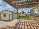 Spacious backyard deck with a wooden pergola and string lights for outdoor entertaining at 2155 S Emerson St, Denver, CO 80210