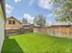Large, grassy backyard with a wooden fence, perfect for outdoor activities and enjoyment at 2155 S Emerson St, Denver, CO 80210