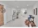 Basement hallway featuring carpet, wall art, and an open doorway to a bedroom at 2155 S Emerson St, Denver, CO 80210
