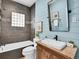 Charming bathroom featuring a stylish vanity, modern fixtures, and a soaking tub at 2155 S Emerson St, Denver, CO 80210