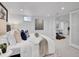 Spacious bedroom featuring a queen-size bed, wall art and white walls and carpet at 2155 S Emerson St, Denver, CO 80210