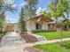 Beautifully renovated home with mature trees, new landscaping, and a private driveway at 2155 S Emerson St, Denver, CO 80210
