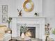 Close-up of living room fireplace with marble tile, decorative mantle, and stylish decor at 2155 S Emerson St, Denver, CO 80210