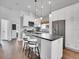 Spacious kitchen with a large island, modern appliances, and seamless flow to other living spaces at 2155 S Emerson St, Denver, CO 80210