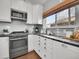 Bright modern kitchen features quartz countertops, stainless steel appliances, and subway tile backsplash at 2155 S Emerson St, Denver, CO 80210