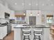 Modern kitchen with stainless steel appliances, quartz countertops and white cabinetry at 2155 S Emerson St, Denver, CO 80210