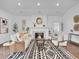 Bright living room featuring a fireplace, stylish seating, and modern decor at 2155 S Emerson St, Denver, CO 80210