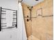 Modern shower featuring brown tile, a built-in niche, and a sleek rainfall shower head at 2155 S Emerson St, Denver, CO 80210