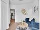 Stylish sitting area with views to the kitchen and two cozy blue chairs at 2155 S Emerson St, Denver, CO 80210