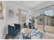 Bright sitting room featuring comfortable seating, stylish decor, and a sliding glass door at 2155 S Emerson St, Denver, CO 80210