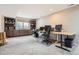Spacious basement office space with built-in shelving and multiple desks at 746 Poppywood Dr, Highlands Ranch, CO 80126