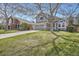 Beautifully landscaped front yard with mature trees, complementing the home's curb appeal at 746 Poppywood Dr, Highlands Ranch, CO 80126
