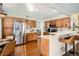 Spacious kitchen featuring stainless steel appliances and hardwood floors at 746 Poppywood Dr, Highlands Ranch, CO 80126