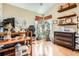 Bright home office with hardwood floors, plant shelves, and a vaulted ceiling at 746 Poppywood Dr, Highlands Ranch, CO 80126