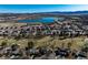 Picturesque aerial view showing the layout of houses in relation to the golf course and waterfront, creating a serene atmosphere at 22 Wedge Way, Littleton, CO 80123