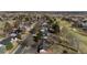 Aerial view captures the community's layout with tree-lined streets, golf course access, and single-Gathering homes at 22 Wedge Way, Littleton, CO 80123