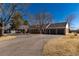 Charming single story brick home with a three car garage and circular driveway at 22 Wedge Way, Littleton, CO 80123