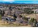 Bird's-eye view capturing the neighborhood, surrounded by green spaces and mature trees at 22 Wedge Way, Littleton, CO 80123