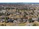 Panoramic aerial view showcasing the neighborhood, with lush green golf course weaving between residences at 22 Wedge Way, Littleton, CO 80123