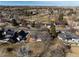 Aerial image showcasing homes nestled within a lush, green golf course, offering serene views at 22 Wedge Way, Littleton, CO 80123