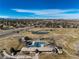 Beautiful aerial shot featuring a pool and an adjacent recreational area and golf course at 22 Wedge Way, Littleton, CO 80123