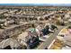 Expansive aerial view of a residential area showcasing a house with a private pool and mature trees at 10057 S Shadow Hill Dr, Lone Tree, CO 80124