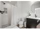 Bright bathroom features a shower with white subway tile and dark vanity with a white countertop and modern sink at 10057 S Shadow Hill Dr, Lone Tree, CO 80124