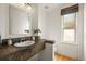 Well-lit powder room featuring a tile counter, a modern sink, and a window for natural light at 10057 S Shadow Hill Dr, Lone Tree, CO 80124