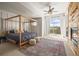 Stylish main bedroom with a fireplace, a four-poster bed, and a sliding glass door to the balcony at 10057 S Shadow Hill Dr, Lone Tree, CO 80124