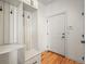 Organized mudroom with a built-in storage bench and hooks by the entrance at 10057 S Shadow Hill Dr, Lone Tree, CO 80124