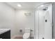 Updated bathroom includes glass shower with matte black fixtures and a modern vanity at 719 W 7Th Ave, Denver, CO 80204