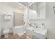 Modern bathroom featuring a glass shower, sleek vanity, and tiled accent wall at 719 W 7Th Ave, Denver, CO 80204