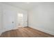 Bright bedroom with hardwood floors, large windows, and natural light at 719 W 7Th Ave, Denver, CO 80204