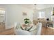 Cozy dining area with a glass table, modern chairs, and a charming decorative plant at 719 W 7Th Ave, Denver, CO 80204