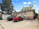 This backyard includes ample parking and a well-maintained brick building, blending practicality with classic charm at 746 Birch St, Denver, CO 80220