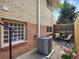 The patio area features an AC unit, brick wall, and a view of the small outdoor space, offering a private retreat at 746 Birch St, Denver, CO 80220