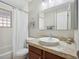 Bathroom featuring a vanity with a light wood cabinet and shower with curtain at 746 Birch St, Denver, CO 80220